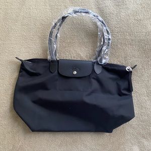 Brand new, never used, all black Longchamp shoulder bag